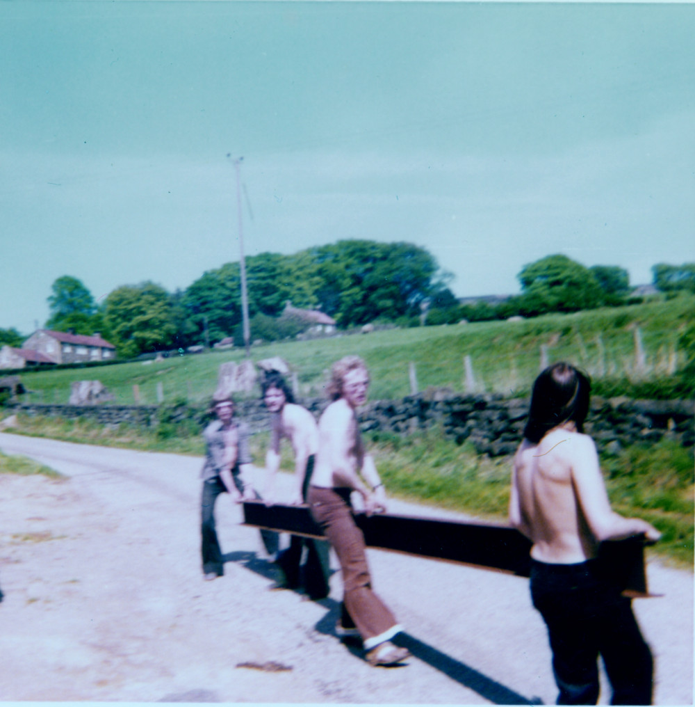 Building Chisel Hill Mill Studio - four young men carrying a RSJ