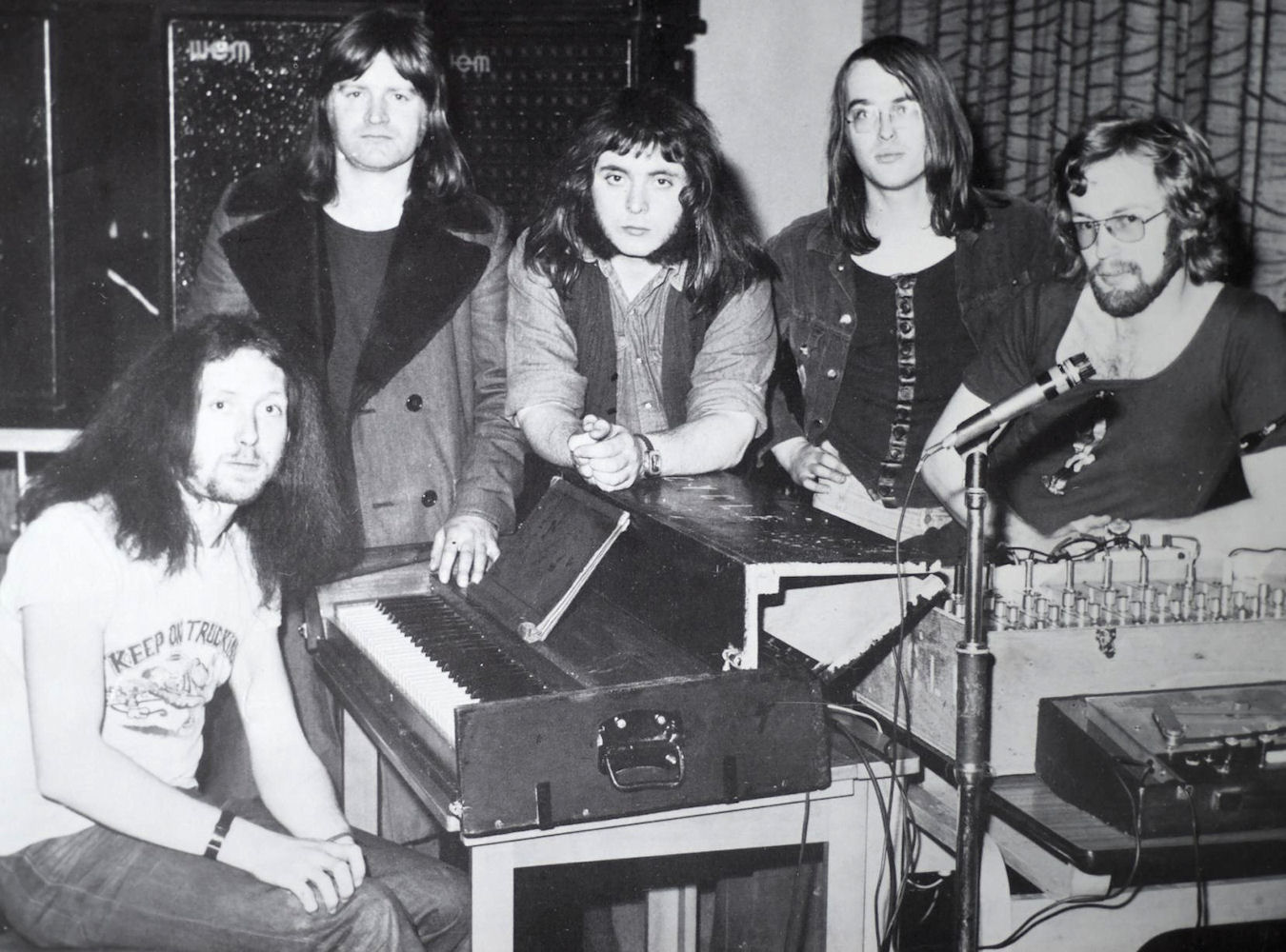 Publicity photo of Cycle standing around the PA mixer.