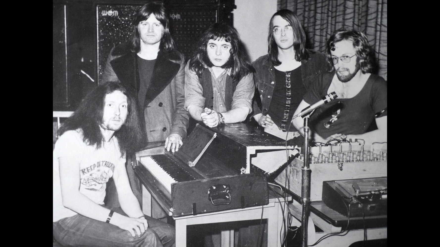 Publicity photo of Cycle standing around the PA mixer.